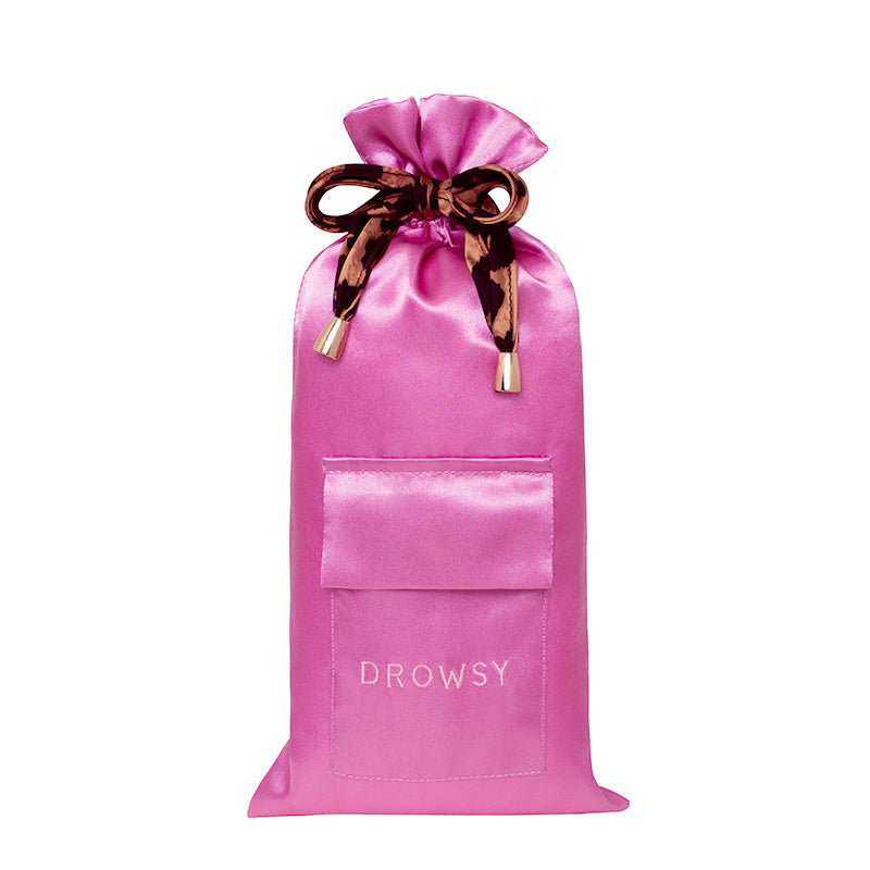 The Hotel Paradiso Carry Pouch from us.drowsysleepco is a bright pink satin bag with a front pocket, "DROWSY" embroidery, and a patterned ribbon—perfect for keeping your silk eye mask and essentials organized in style.
