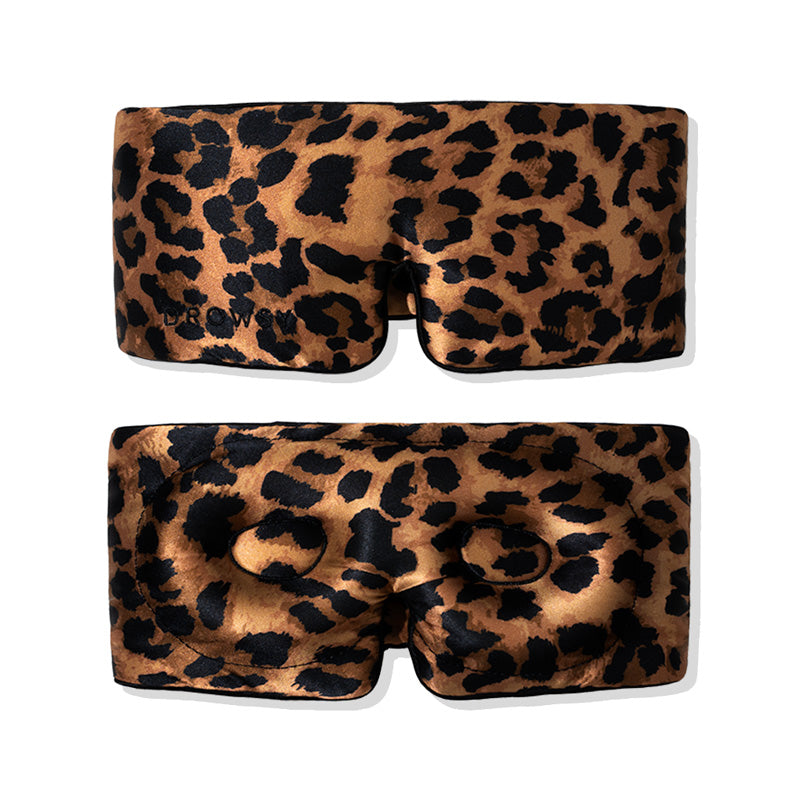Two us.drowsysleepco Hotel Paradiso Wild Thing eyelash-protecting masks with brown and black leopard print are shown, one displaying the front and the other the back with contoured eyecups for comfort.