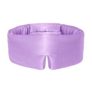 The Lavender Haze by drowsysleepco is a lavender silk sleep mask with a wide band and DROWSY embroidery. Its padded design and center notch over the nose ensure comfort and make it ideal for beauty sleep.