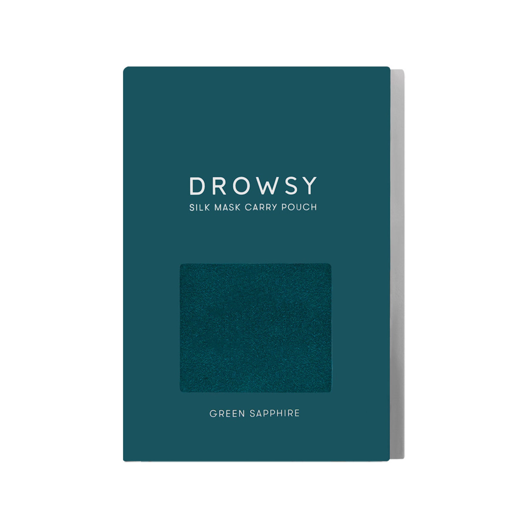 A dark teal rectangular box from drowsysleepco labeled Green Sapphire Silk Carry Pouch, featuring a cut-out window that displays the silk sleep mask fabric in the Green Sapphire shade.
