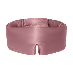 The Damask Rose eye mask by drowsysleepco is mauve mulberry silk, features DROWSY embossed on the left and a small notch at the bottom center. Soft, padded, and crafted for comfort.