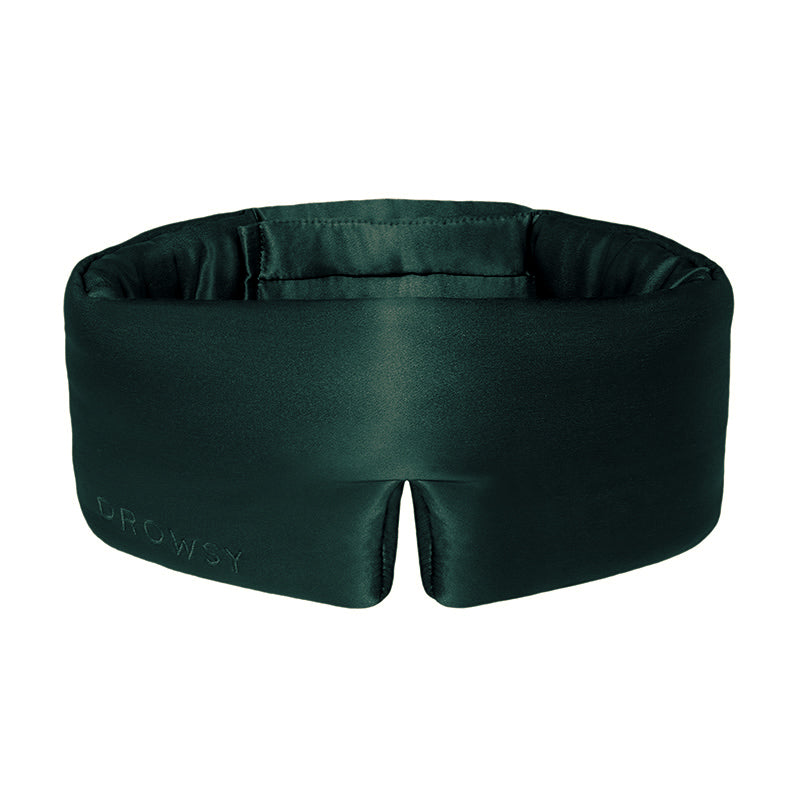 Dark green contoured Ivy Garden silk sleep mask with a velcro strap for beauty sleep.
