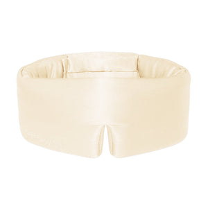 The us.drowsysleepco Champagne Gold silk eye mask features a cream hue, plush padding, a wide band, and a contoured bottom to block light and promote deep beauty sleep.