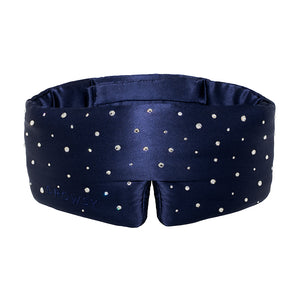 The Silk Sleep Mask Crystals by Swarovski® from drowsysleepco features navy blue silk, sparkling Swarovski® crystals for a starry effect, soft padding, blackout coverage, and DROWSY subtly embossed on the fabric.